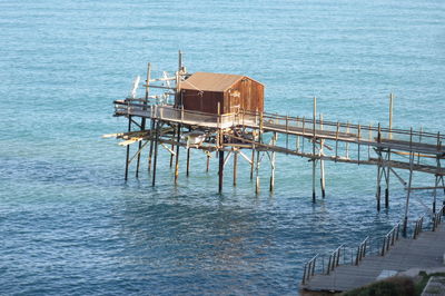 Pier on sea against sky