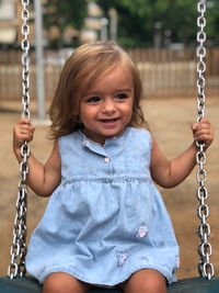 Girl swinging at playground