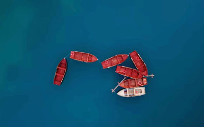 Low angle view of heart shape against blue sky