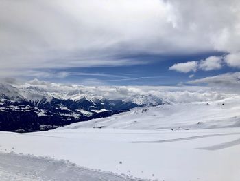 Scenic view of snow covered mountain against sky