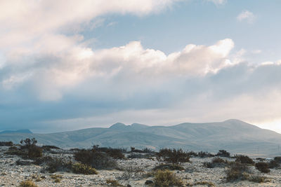 Clouds over volcanic desert landscape