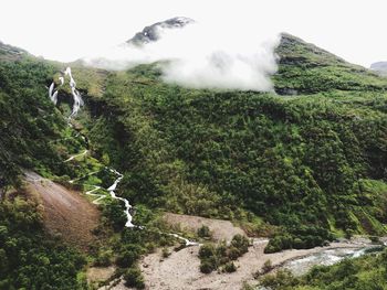 Scenic top view of mountain against foggy sky