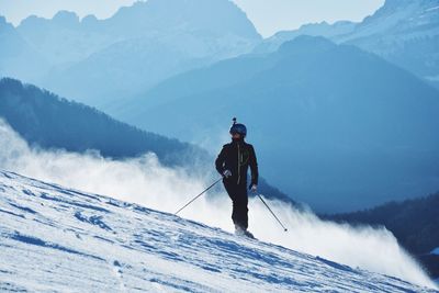 Man skiing on snowcapped mountain