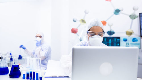 Scientists working in laboratory