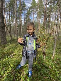 Full length of boy in forest