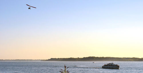 Scenic view of sea against clear sky during sunset