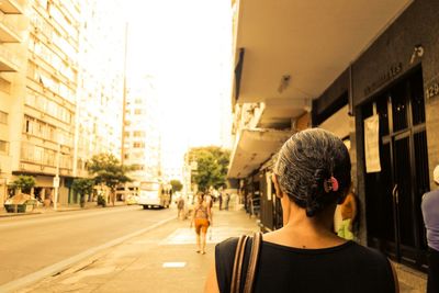 Woman standing in city