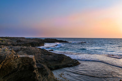 Scenic view of sea against sky during sunset