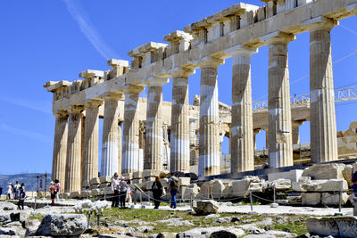 Group of people in front of historical building