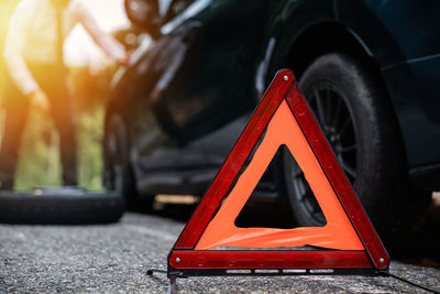 Close-up of car on road