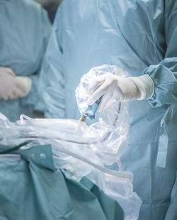 Midsection of surgeon working in operating room