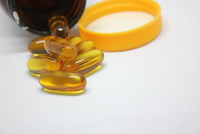 Close-up of yellow bottle on table