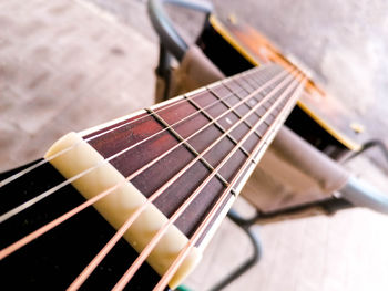 Close-up of guitar on table