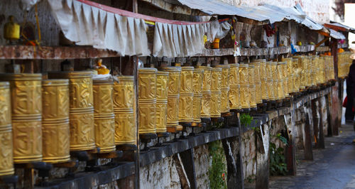 Prayer wheels around the potala palace in lhasa / tibet