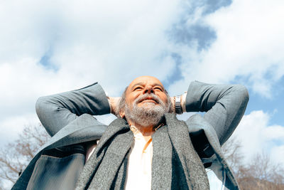 Portrait of a confident, handsome, mature man, pensioner, grandfather in the small town