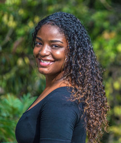 Portrait of smiling woman standing outdoors