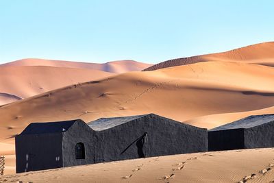 Scenic view of desert against clear sky