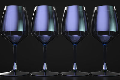 Close-up of wine glass against blue background