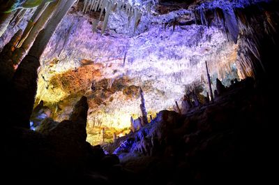 Low angle view of illuminated cave