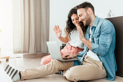 Man using mobile phone at home