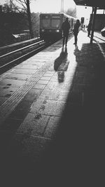 Woman walking on road