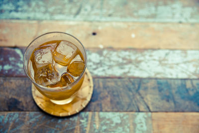 High angle view of ice tea served on table