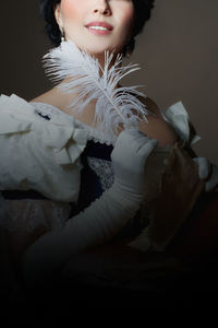 Close-up of young woman lying on bed at home