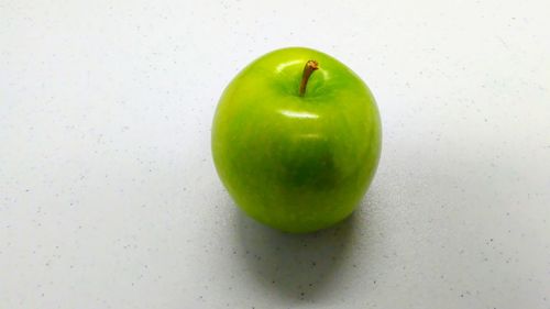 Close-up of apple against white background