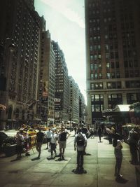People walking on street in city