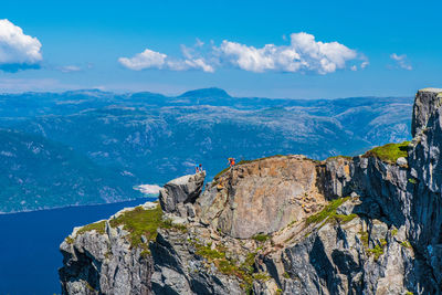 Scenic view of mountains against blue sky