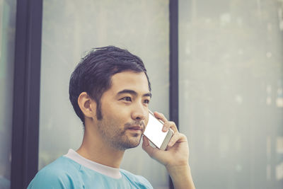 Close-up of man using phone