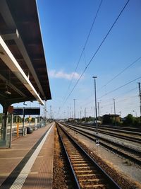 Railroad station platform against sky