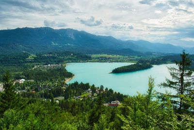 Scenic view of lake and mountains against sky