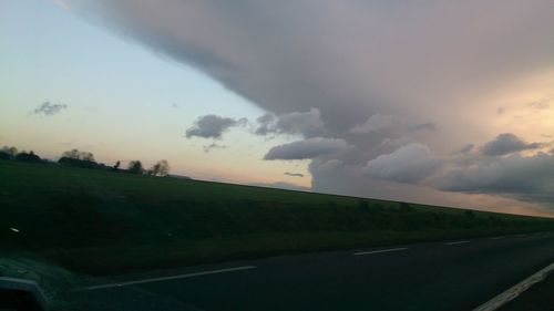 Scenic view of landscape against cloudy sky