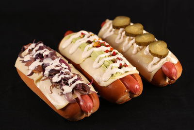 Close-up of hot dog against black background