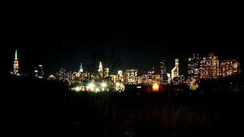 Illuminated city lit up at night