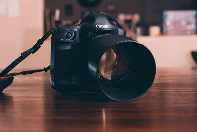 Close-up of camera on table