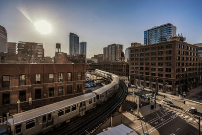 Elevated train along built structures