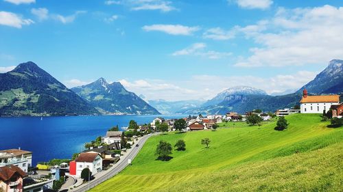 Panoramic view of buildings and mountains against sky