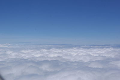 Scenic view of landscape against blue sky