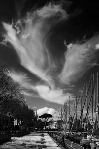 Sailboats in city against sky