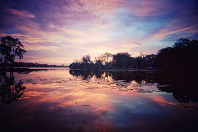 Scenic view of lake against sky during sunset