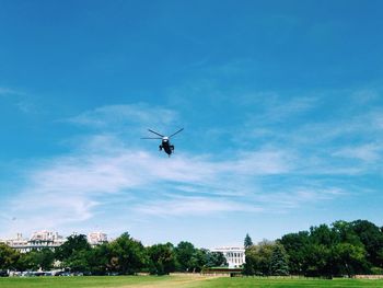 Low angle view of airplane flying in sky