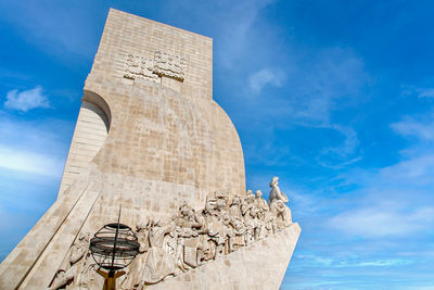 Low angle view of statue against cloudy sky