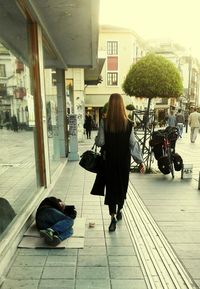 Full length of woman standing in city