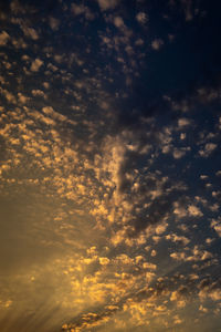 Low angle view of dramatic sky during sunset