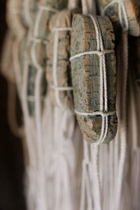 Close-up of wood hanging from rope