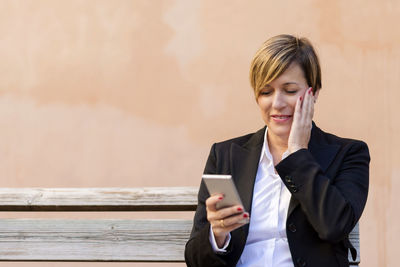 Businesswoman using mobile phone