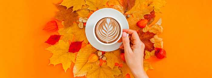 Directly above shot of person holding coffee cup