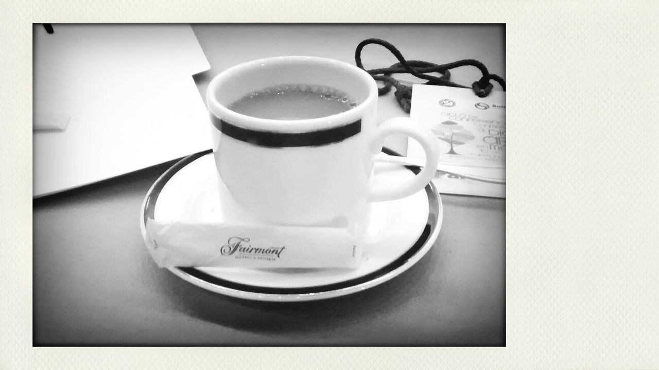 coffee cup, indoors, drink, saucer, food and drink, table, refreshment, coffee - drink, transfer print, cup, still life, coffee, spoon, tea cup, auto post production filter, close-up, freshness, high angle view, no people, black coffee